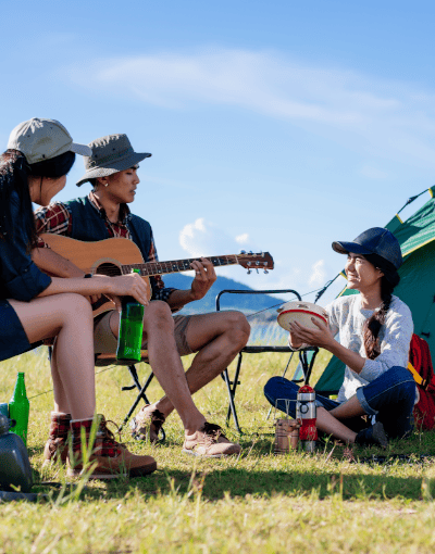 Friends Camping Playing Guitar Together