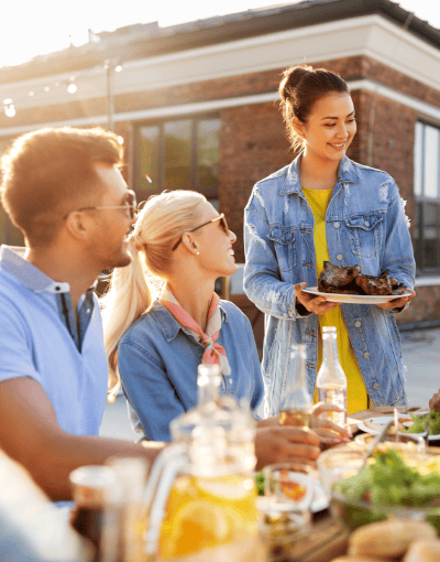 Friends Having Barbecue Outdoors