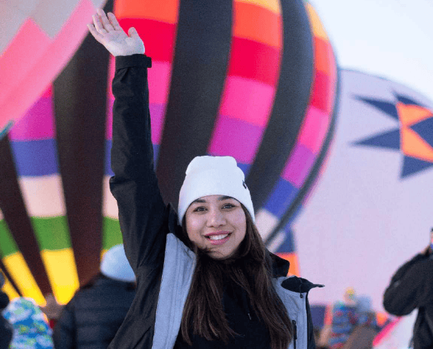 Girl Smiling At Hot Air Balloon Festival