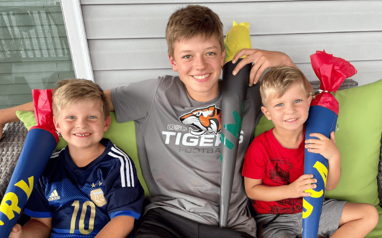 Three Brothers Celebrating With German School Cones