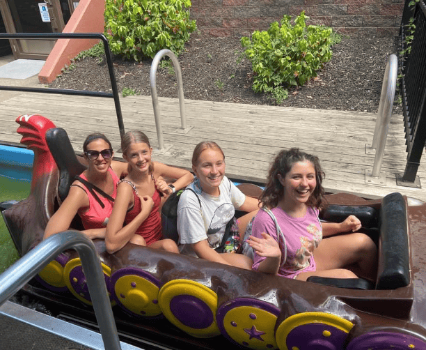 Group On Amusement Ride Smiling