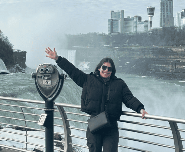 Woman Smiling At Niagara Falls